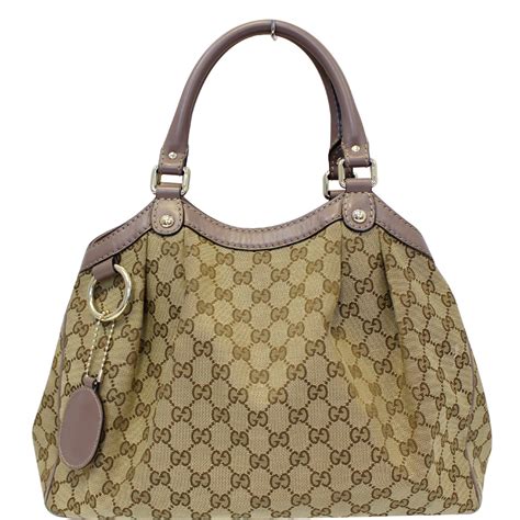 tagliacarte gucci|Gucci canvas bag.